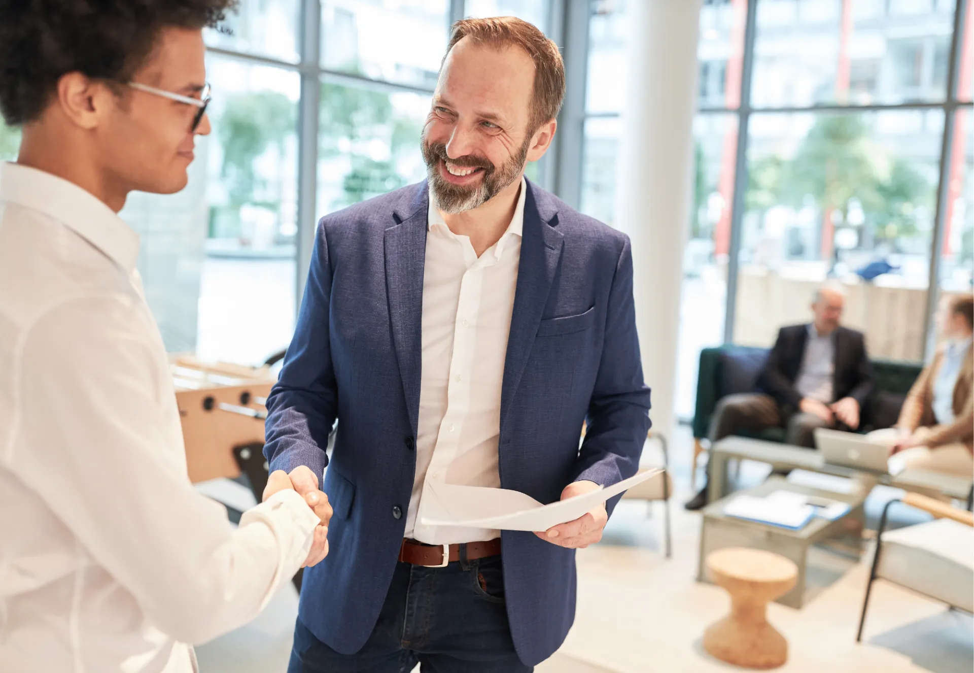A 1MoreThing partner shaking hands with a founder